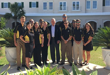 Dennis Crosby, center, with Marlett, left, and Appalachian RMI students in Bermuda.