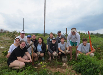 Appalachian students participated in a BIOS sustainability project that involved culling of invasive species and planting two endemic Cedar trees.