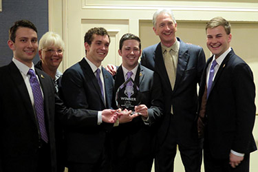 Brantley Risk & Insurance Center Director Karen Epermanis, second from left, and Appalachian's Joseph F. Freeman Distinguished Professor of Insurance Dave Wood, second from right, are pictured with the students and the winner's trophy.