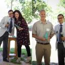 Dr. Panwar presents Green E Awards to Dr. Heather Dixon-Fowler (left), and Dr. Whitehead.