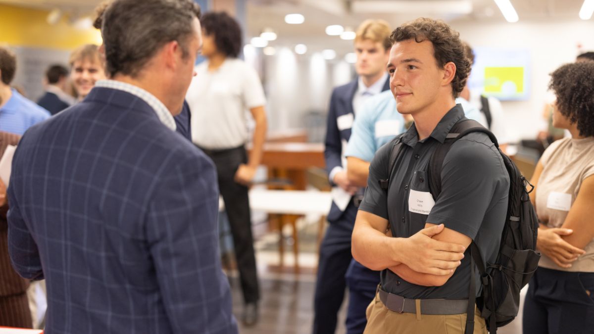 An Appalachian State student listens to a banking representative during a Bank Day conversation about career opportunities in the financial services industry. Photo by Chase Reynolds