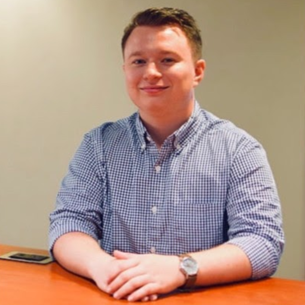 Professional headshot portrait of alumni