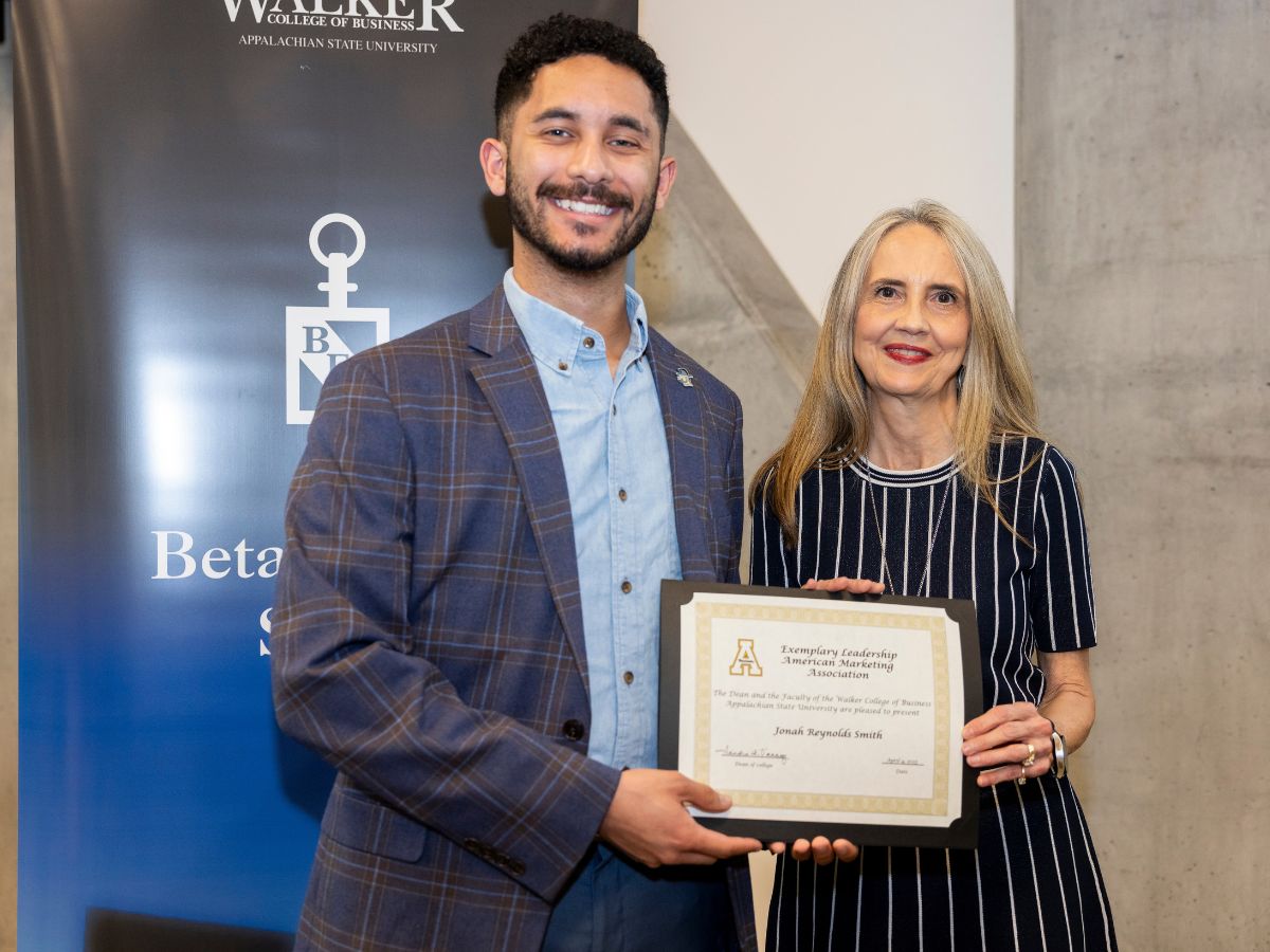 Jonah Smith with Walker College of Business Dean Sandra Vannoy. Smith was honored as the Exemplary Leadership Awardee for the American Marketing Association.