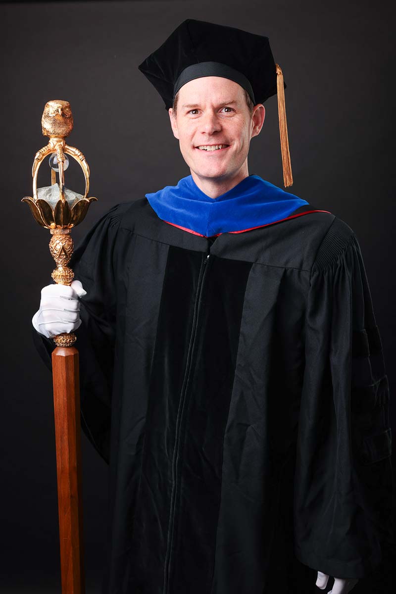 Dr. Justin Cox, with App State mace