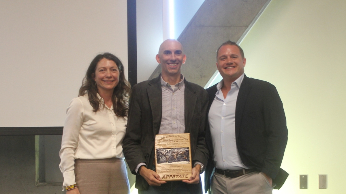 From left are Meredith Pipes, Inspiring International Leaders Awardee Jesse Pipes, and Scott Gray