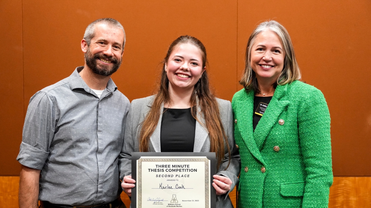 Karlee Cook, center, appears with her faculty mentor Dr. Dennis Guignet, left, and Dr. Ashley Colquitt, associate vice provost and dean of the Cratis D. Williams School of Graduate Studies, at App State&rsquo;s 14th Annual Three Minute Thesis (3MT) competition.