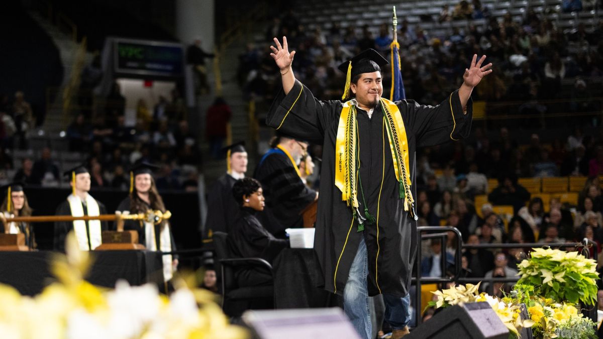 Uriel Rivera Herrera crosses the stage at App State&rsquo;s December 2025 Commencement ceremony.