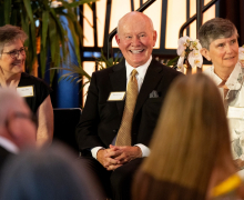 Doug Johnson, center,with two fellow awardees at the 2026 Alumni Gala. Photo by Kyla Willoughby