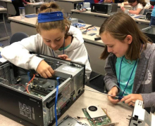 Middle school students work on a hands‑on IT project during a previous summer camp.
