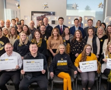 Students, faculty and staff in the Walker College of Business share their support for App State on iBackAPP Day, March 6. Pictured at center in the front row is Walker College of Business Dean Sandra Vannoy. 