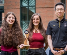 Grace Waugh, a senior sustainable technology major from Chapel Hill, far left, and Summer Gee ’20, a graduate student from Wrightsville Beach, center, were part of a multidisciplinary team of App State undergraduate and graduate students that won second place in its division in the 2021–22 U.S. Department of Energy Solar District Cup. Waugh and Gee are pictured holding the trophy that the team received and with the team’s faculty adviser, Dr. Jaewon Oh... 