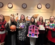 Staff members in the Walker College of Business display some of the toys the Walker Impact Network donated