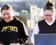 Photo by Kyla Willoughby App State’s online bachelor’s programs and graduate programs in business, education and nursing — offered through App State Online — are ranked among the best in the nation by U.S. News & World Report, which recognized the university in its “2026 Best Online Programs” rankings. Pictured, two Mountaineer students smile while working on their laptops.