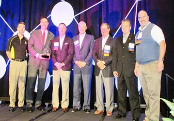 Brantley Risk & Insurance Center Associate Director Greg Langdon, left, presented IIANC CEO Aubie Knight, second from left, and members of the IIANC Board of Directors Scott Evans, Jeff Haney, Bill Vogedes, Jim Mozingo and past Chairman Bobby Salmon