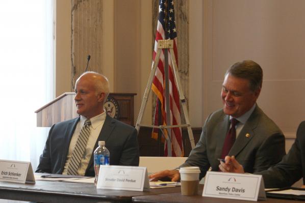 Erich Schlenker, director of the Appalachian State University Transportation Insight Center for Entrepreneurship, sits beside discussion leader Sen. David Perdue, R-Ga., during the Appalachia Task Force discussions in Washington, D.C., May 23.
