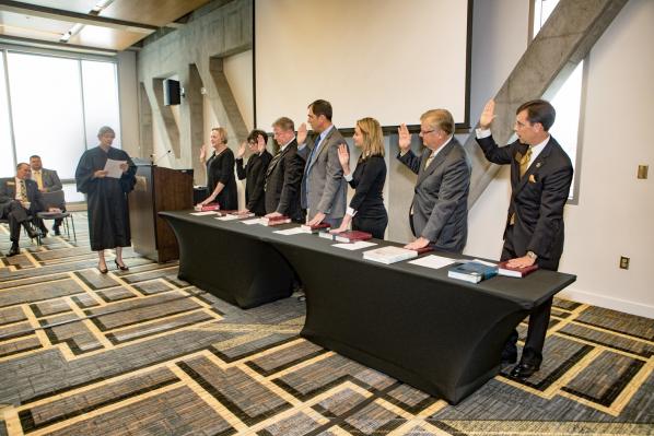Seven individuals were sworn in as trustees of Appalachian State University at the Sept. 22 meeting of the Board of Trustees. They are, from left, Carole P. Wilson, Bonnie Schaefer, Charles V. Murray, Scott Lampe, Anderson Clayton, Donald C. Beaver and M. Lee Barnes Jr. Administering the oath of office was District Judge Rebecca Eggers-Gryder. Photo by Marie Freeman