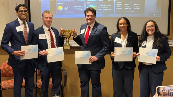 2026 Broyhill Fellows stand with certificates and a trophy after winning the CFA Institute Research Challenge Americas Region first round