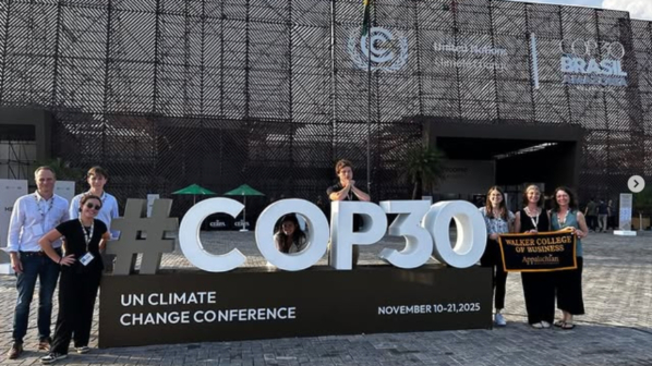 App State students and faculty with the COP30 sign in Brazil