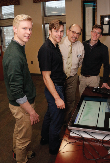 Photo of Kiefer Smith, left, Dan Emery, Associate Dean Martin Meznar and Cameron Barnett.