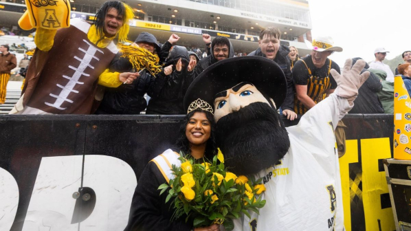 Supply chain management major Zoe Raj stands with Yosef after being named App State's 2026 Top of the Rock
