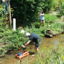 Eric Cheek ’18, Quantitative Geoscience major and Carly Maas, senior, Quantitative Geoscience major, measuring stream discharge in Boone Creek. Photo by Dr. William Anderson.