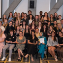 Dozens of recipients of App State Black and Gold Awards smiling at the awards ceremony