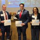 2026 Broyhill Fellows stand with certificates and a trophy after winning the CFA Institute Research Challenge Americas Region first round