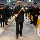 Johnny Brown, captain of operations for Appalachian State University's Appalachian Police Department, carries the university mace during one of App State's 13 in-person Spring 2021 Commencement ceremonies, held May 7–12 in Holmes Convocation Center on App State’s campus. 