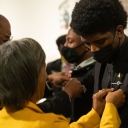 Charles Johnson III, a 2021–22 Fleming Scholar from Parkton, receives his Fleming Scholars pin from Judge Gary Henderson ’92 ’94 during the Dr. Willie C. Fleming Scholarship Reception held Oct. 29 on Appalachian State University’s campus.