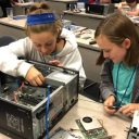 Middle school students work on a hands‑on IT project during a previous summer camp.