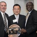 Dr. Randy Edwards, Appalachian’s vice chancellor for university advancement, far left, and Dr. Jesse Lutabingwa, associate vice chancellor for international education and development at Appalachian, far right, present Jigang “Harrison” He with the inaugural Appalachian Global Engagement Award at the Global Leadership Awards Luncheon held during Appalachian’s International Education Week in November. 