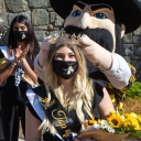 Alexandra LaRocca, a senior communication studies major from Raleigh, was crowned Appalachian State University’s 2020 Top of the Rock by university mascot Yosef as App State Chancellor Sheri Everts, far left in background, looked on. The ceremony was prerecorded in Founders Plaza during Homecoming Week and then screened during the homecoming football game Oct. 22. 