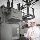 Data gathering: NRLP General Manager Ed Miller is holding an Advanced Metering Infrastructure (AMI) device which, when installed at the customer site, will enable measurement of detailed, time-based information and frequent collection and transmittal of such information to the supplier.