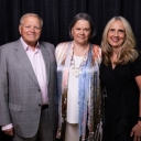 Kathy Pou, center, earned her BSBA degree in economics from App State's Walker College of Business in 1979. In 2025, she was named alumna of the year for the Walker College of Business. She stands with her husband, Bill, and Walker College Dean Sandra Vannoy. 