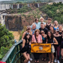 A group of students at Iguacu Falls on the Brazil and Argentina border in May. These falls lie a few miles from the largest hydroelectric plant in the Western Hemisphere, a place the students visited during the program. 