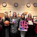 Staff members in the Walker College of Business display some of the toys the Walker Impact Network donated