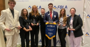 From left are Carson Smith, Shanaoha Locklear, Sydney Mills, FBLA-Collegiate National President Toby Neal, Justin Schroeder, Athena Ackerman and Addison Kocell.