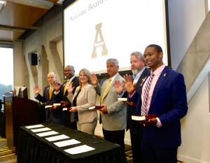 The six individuals who were sworn in as members of the Appalachian State University Board of Trustees during the board’s Sept. 13 meeting held on Appalachian’s campus. They are, from left to right, John M. Blackburn, James “J.K.” Reaves ’93, Kimberly Shepherd ’97, Thomas Sofield ’76, Mark E. Ricks ’89 and DeJon Milbourne. Administering the oath of office was North Carolina District Court Judge Rebecca Eggers-Gryder ’83 (not pictured).