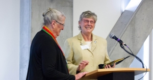 Dawn Medlin presents a gift to Doris Medlin, to recognize the establishment of the Bob and Doris Medlin Scholarship, named for Medlin.