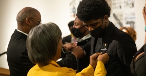 Charles Johnson III, a 2021–22 Fleming Scholar from Parkton, receives his Fleming Scholars pin from Judge Gary Henderson ’92 ’94 during the Dr. Willie C. Fleming Scholarship Reception held Oct. 29 on Appalachian State University’s campus.