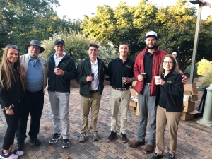 Pictured are Beroth Oil President (ret.) Winfield Beroth '65, second from left, and Walker College of Business Dean Heather Norris, far right. An early shot-gun start was cause for coffee for golfers and student volunteers, alike.