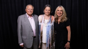 Kathy Pou, center, earned her BSBA degree in economics from App State's Walker College of Business in 1979. In 2025, she was named alumna of the year for the Walker College of Business. She stands with her husband, Bill, and Walker College Dean Sandra Vannoy.