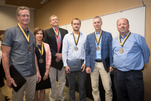 Winners of the 2018 Appalachian Excellence in Teaching Awards at the Fall Semester Faculty and Staff Meeting. From left: Dr. Thomas Whyte, professor in the Department of Anthropology; Dr. Susan Staub, professor in the Department of English; Dr. Richard Pouder, professor in the Department of Management; Dr. Gabriele Casale, associate professor in the Department of Geological and Environmental Sciences; Dr. William “Bill” Anderson, professor in and chair of the Department of Geological and Environment Science