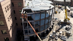 Drone Photo by Wes Craig Vannoy Construction install a time capsule beam, signed by hundreds at App State, in the Peacock Hall addition