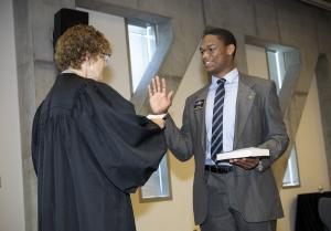 Student Government Association President DeJon McCoy-Milbourne is sworn in to Appalachian State University’s Board of Trustees by North Carolina District Judge Rebecca Eggers-Gryder at the June 22 Board of Trustees meeting. McCoy-Milbourne, of Fayetteville, is a senior quadruple major in finance and banking, risk management and insurance, accounting and economics. Photo by Troy Tuttle.