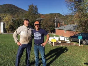 Dr. Joseph Cazier, left, and Dr. James Wilkes, members of Appalachian’s Center for Analytics Research and Education (CARE) team, check on beehives installed on Howard Street in Boone. Cazier is a professor in the Department of Computer Information Systems, and Wilkes is a professor in the Department of Computer Science. 