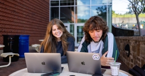 App State’s online bachelor’s programs and graduate programs in business, education and nursing — offered through App State Online — are ranked among the best in the nation by U.S. News & World Report, which recognized the university in its “2025 Best Online Programs” rankings. Mountaineer students Caroline Flanigan, a junior sustainable technology and business double major from Holly Springs, left, and Sean Glasgow, a sophomore music industry studies major from Cary, are pictured working on their laptops