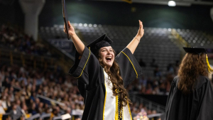 Fiscal years 2025 and 2026 mark the most successful fundraising years in App State’s history, with the university securing more than $50 million in private donations each year — funds that directly support App State students. During the milestone period, every major area of the university has benefited, with contributions supporting academics and athletics. Pictured, an App State graduate celebrates at App State’s Spring 2026 Commencement, held May 7–9 on the Boone campus. Photo by Chase Reynolds