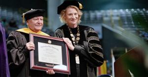 Appalachian Chancellor Sheri Everts, right, presents Dr. William “Bill” Holland with an honorary Doctor of Humane Letters. Photo by Chase Reynolds