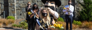 Alexandra LaRocca, a senior communication studies major from Raleigh, was crowned Appalachian State University’s 2020 Top of the Rock by university mascot Yosef as App State Chancellor Sheri Everts, far left in background, looked on. The ceremony was prerecorded in Founders Plaza during Homecoming Week and then screened during the homecoming football game Oct. 22. 